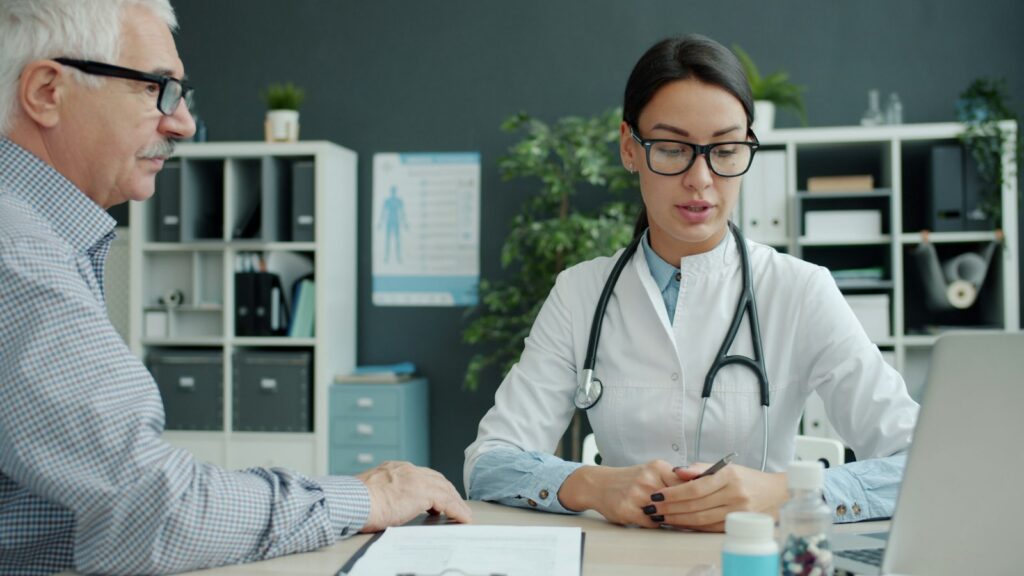 Physician spending time with an older patient during an unhurried office visit